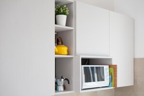 Departamento, 1 habitación | Cocina privada | Refrigerador con congelador, microondas, horno y parrilla de estufa