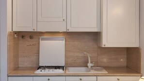 Fridge, microwave, stovetop, coffee/tea maker