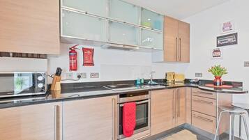 Fridge, microwave, toaster, cookware/dishes/utensils