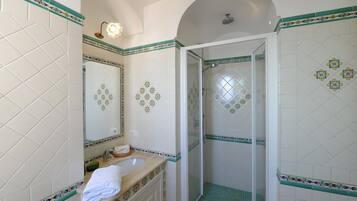 Bathtub, hair dryer, towels, soap