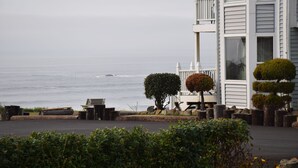 A coastal building with a balcony overlooking the sea. - Schooner Landing (Newport)