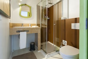 Shower, hair dryer, towels, toilet paper