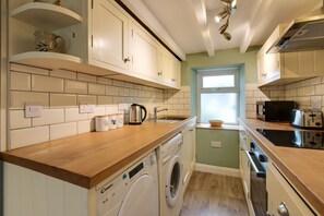 Fridge, microwave, oven, cookware/dishes/utensils