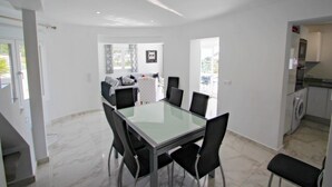 A modern kitchen with white cabinets and a built-in oven. - Gila - sea view villa with private pool in Benissa (Benissa)