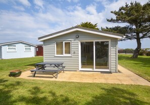 Enjoy a home away from home with a patio and picnic table.
