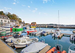 Boats docked at the marina, offering scenic views of the waterfront.