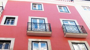 A multi-story building with balconies and windows. - Contemporary by Apartments Alfama (Lisbon)