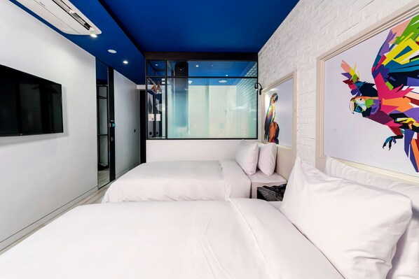 A modern hotel room with a white bed, a large window, a mounted TV, and a colorful abstract painting. - Hotel the Designers DDP (Seoul)