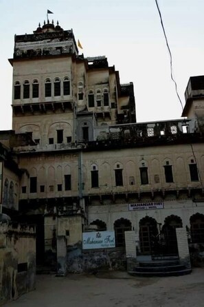 A historic building with a sign reading "MAHANSAR PORT HOTEL." - Mahansar Fort Heritage Homestay (Malasisar)