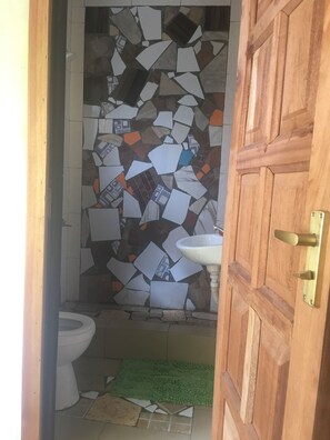 Signature Studio, Garden View, Garden Area | Bathroom | Shower, hair dryer, towels - Legassi Gardens Apartments (Kwabenya)