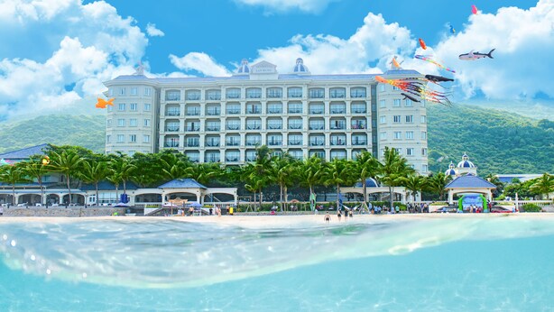 A hotel with a beachfront view, multiple balconies, and a pool area. - Lan Rung Beach Resort (Ho Chi Minh City)