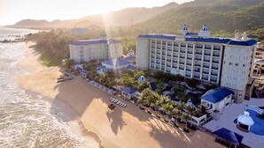 A beachfront hotel with multiple buildings, a beach, and a pool area. - Lan Rung Beach Resort (Ho Chi Minh City)