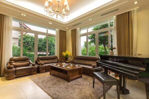 Suite, 3 Bedrooms, Kitchenette, Pool View | Living room | 36-inch LCD TV with cable channels, TV