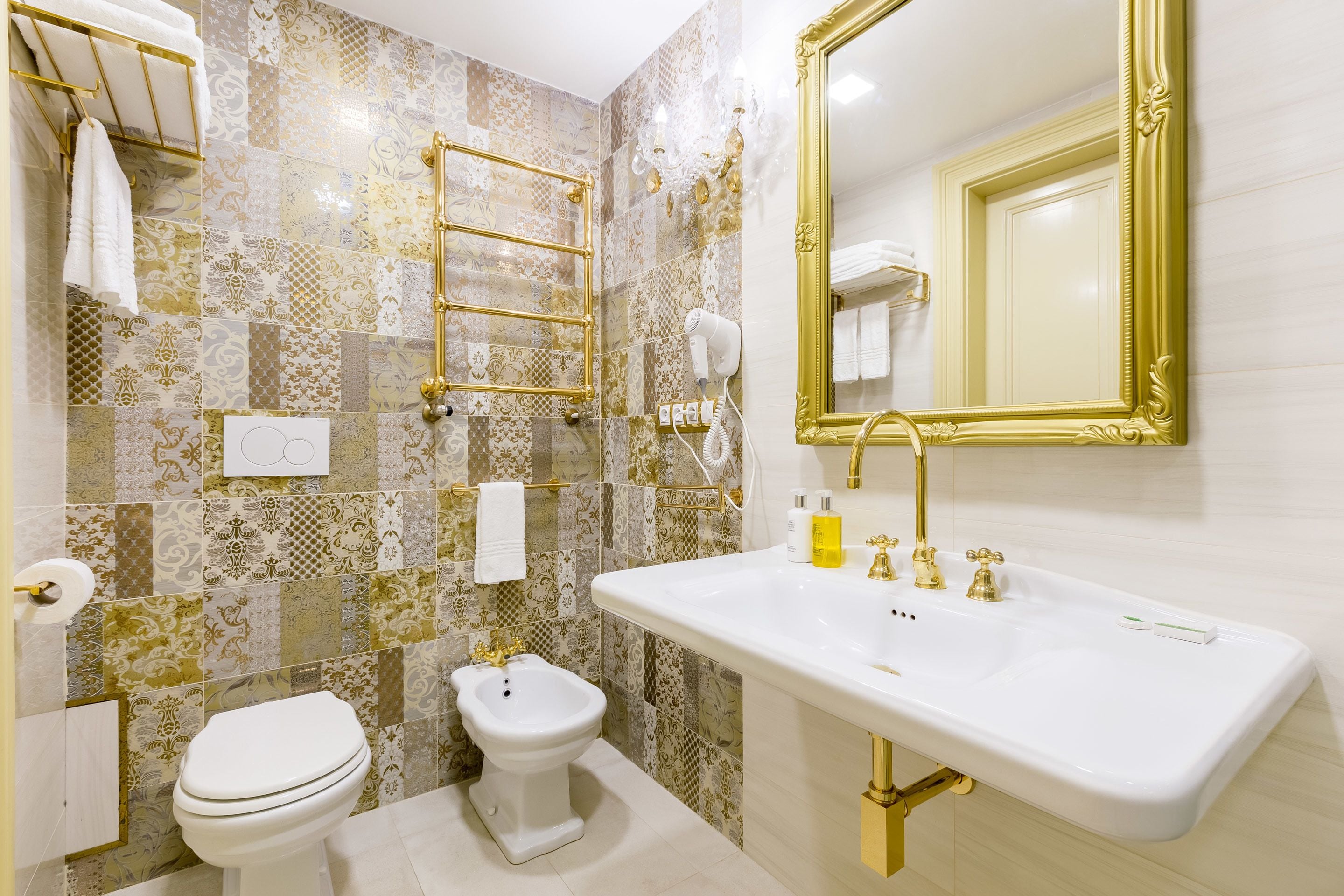 designer toiletries, hair dryer, slippers, bidet