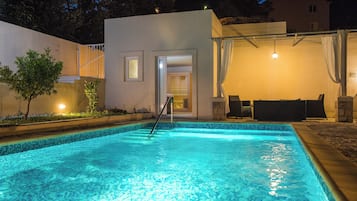 Seasonal outdoor pool, pool umbrellas, pool loungers