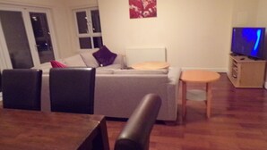Classic Triple Room, 3 Bedrooms, Harbor View | Living area | Flat-screen TV