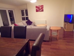 Classic Triple Room, 3 Bedrooms, Harbor View | Living area | Flat-screen TV