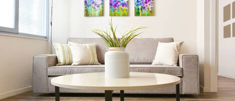 Apartment, 1 Bedroom, Balcony | Living room | Flat-screen TV