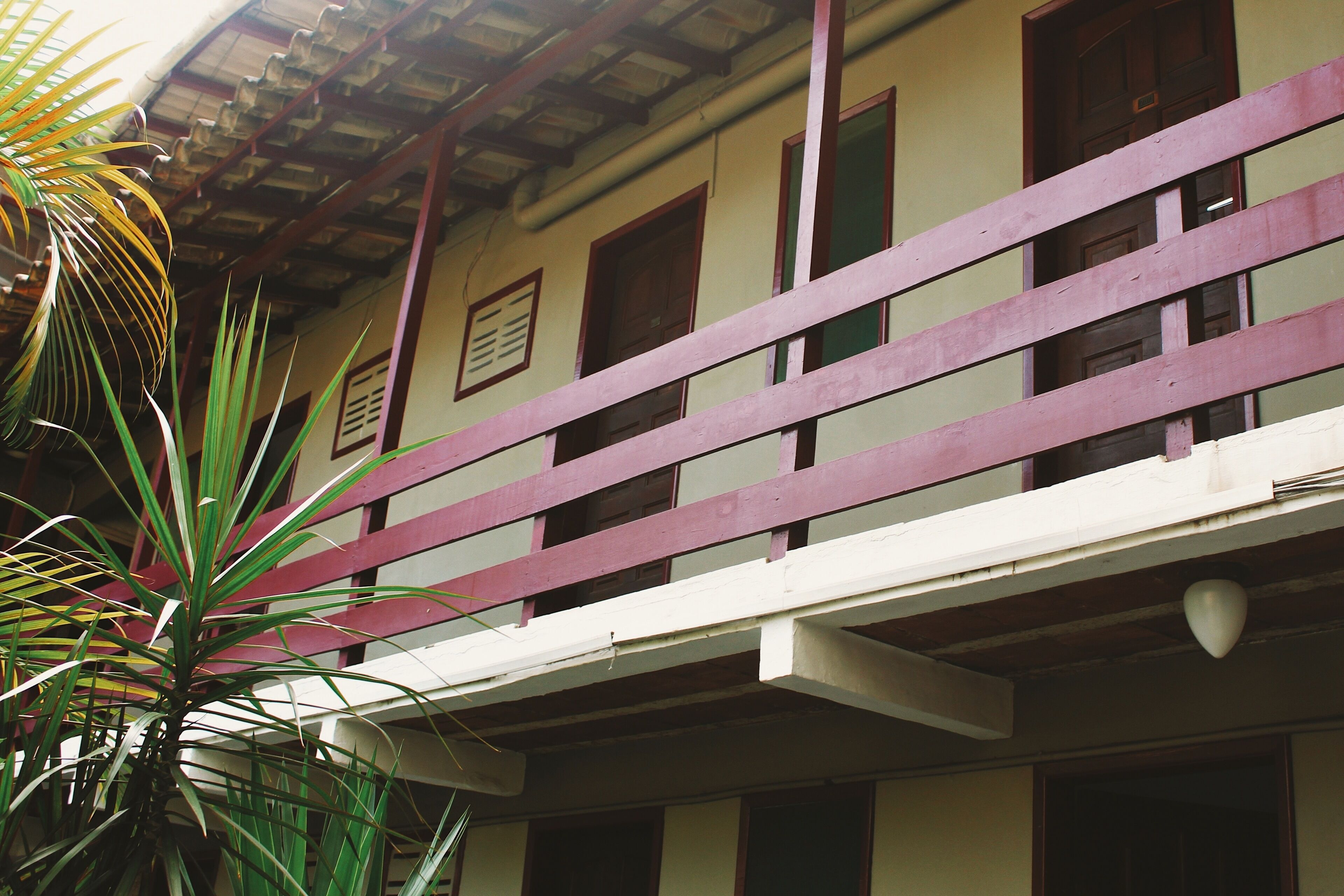 A building with multiple windows and a balcony.