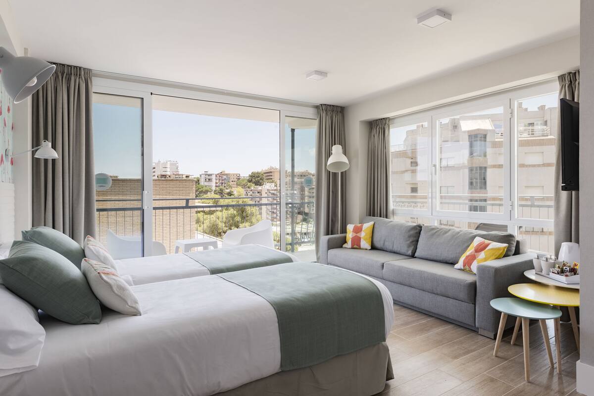 Family Twin Room, 1 Bedroom | In-room safe, desk, blackout drapes, iron/ironing board