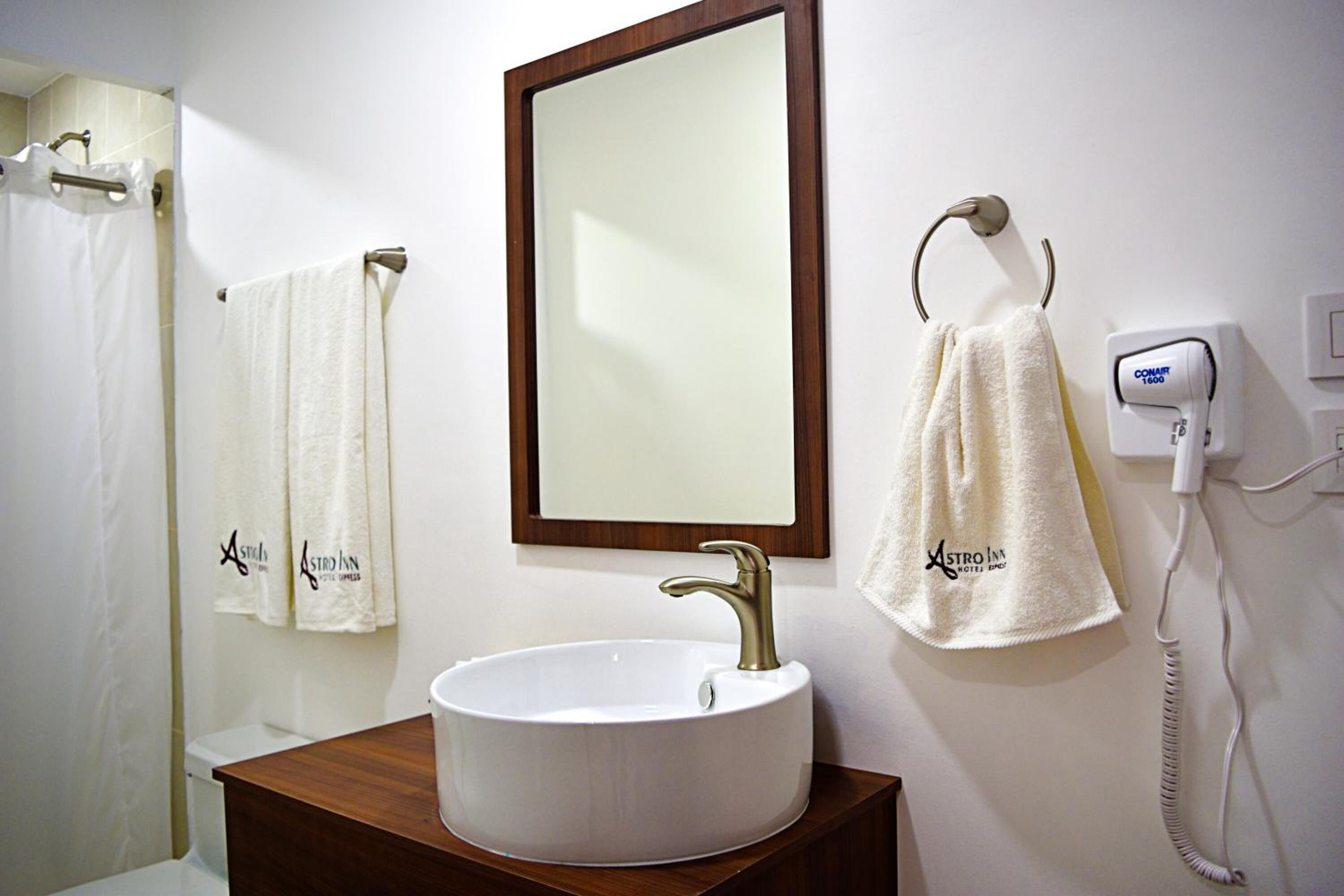 shower, designer toiletries, hair dryer, towels