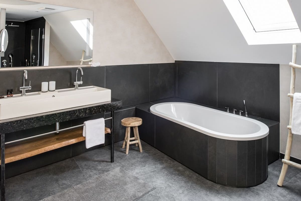 suite, 1 king bed with sofa bed, kitchenette | bathroom | deep-soaking bathtub, free toiletries, hair dryer, bathrobes