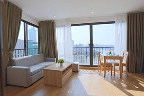 Deluxe Apartment, 1 Queen Bed, Lake View, Lakeside | Living area | 42-inch LCD TV with cable channels, TV
