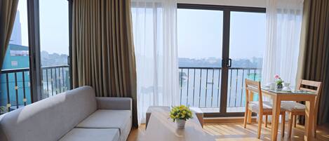 Deluxe Apartment, 1 Queen Bed, Lake View, Lakeside | Living area | 42-inch LCD TV with cable channels, TV
