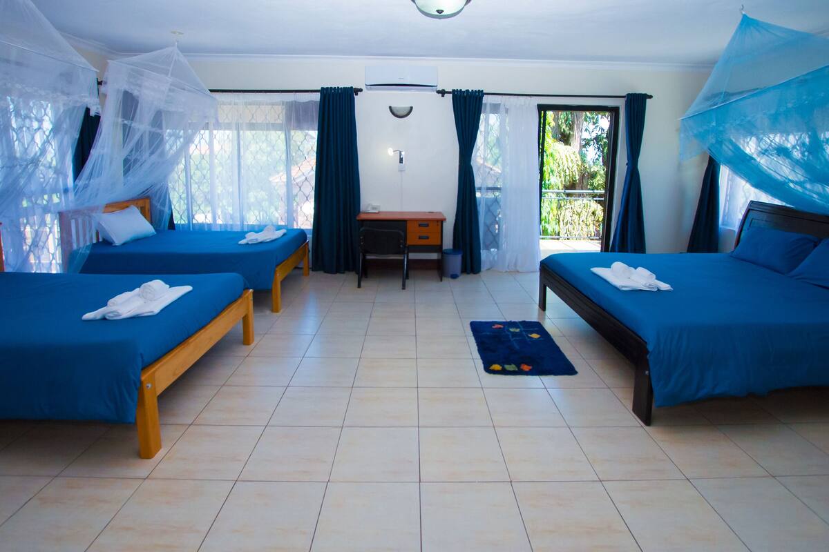Family Triple Room | Minibar, in-room safe, desk, laptop workspace