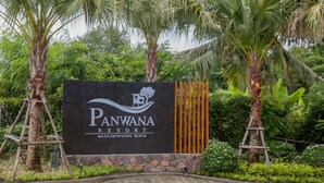 A sign for Panwana Resort with a logo, name, and location. - Panwana Resort (Rayong)