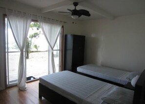 Cottage, Beachfront | Desk, rollaway beds, bed sheets