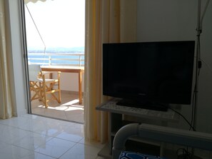 Apartment, 1 Bedroom, Smoking, Sea View | Living area | Flat-screen TV - Atlas Unlimited Sea View Apartment (Loutraki-Agioi Theodoroi)