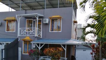 Stroll through the charming garden and enter this two-story home via the covered porch.