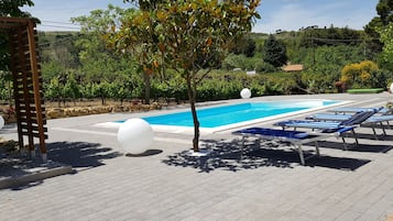 Seasonal outdoor pool, pool umbrellas, sun loungers