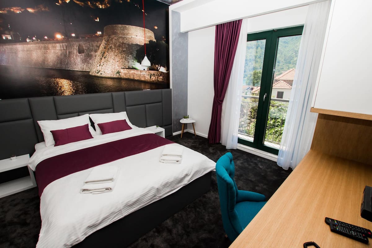 Double Room, Balcony, Partial Sea View | Premium bedding, minibar, in-room safe, desk