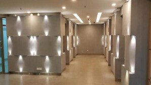 A hallway with a modern design, featuring recessed lighting and a tiled floor. - Cyberjaya Cybersquare Soho Suites (Cyberjaya)