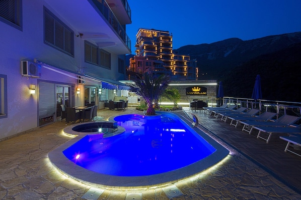 Outdoor pool, pool umbrellas, pool loungers