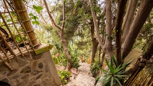 A stone staircase surrounded by lush greenery and bamboo structures. - Baraka Atitlan - Lake & Beach (San Marcos La Laguna)