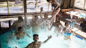 A swimming pool with people enjoying the water. - 113 Standard Condo (Mammoth Lakes)