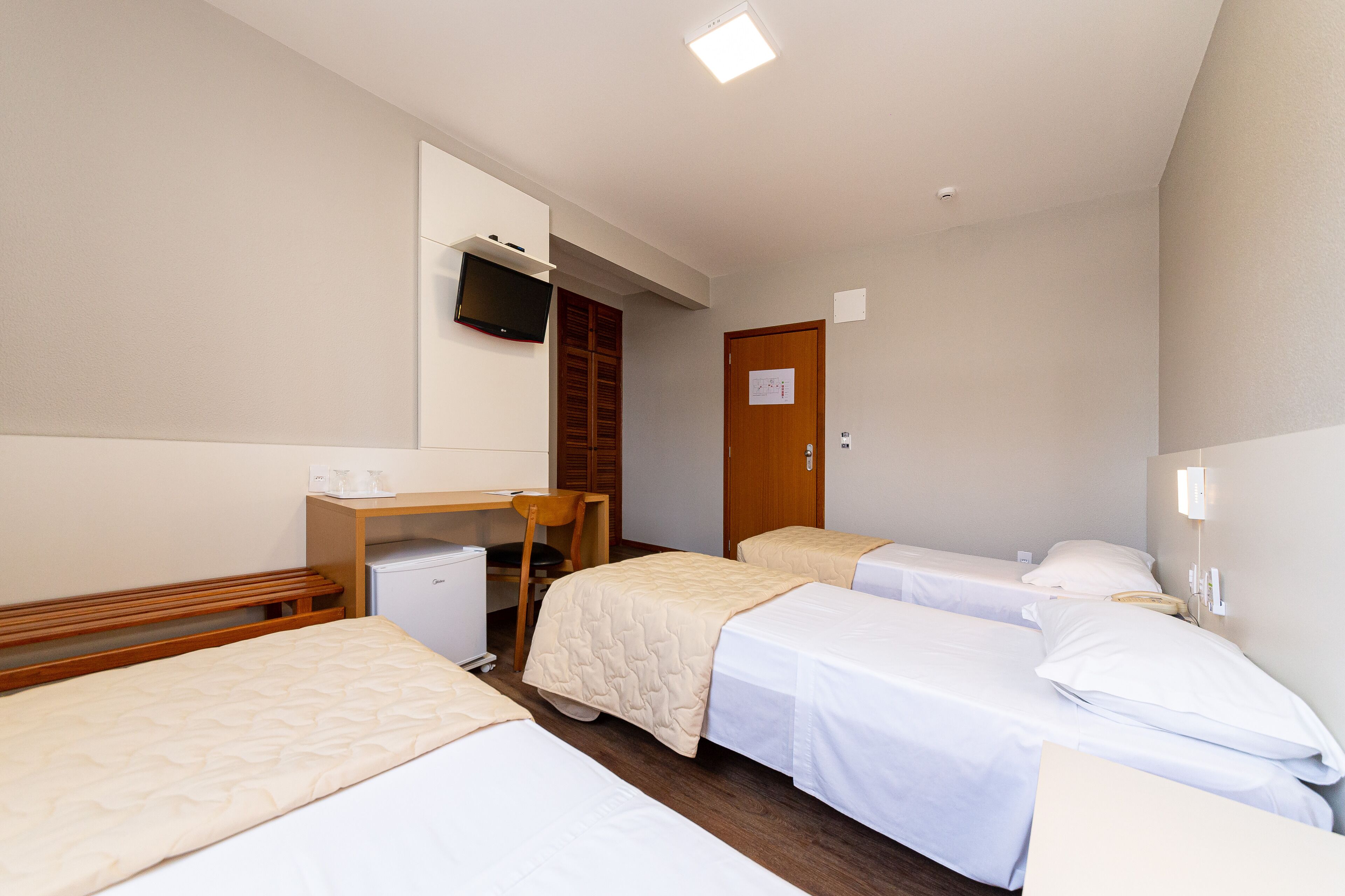 triple room | minibar, desk, blackout curtains, iron/ironing board