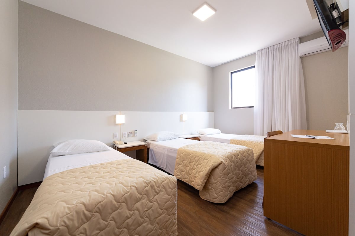 Triple Room | Minibar, desk, blackout curtains, iron/ironing board (on request)