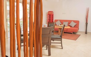 Deluxe Apartment, 2 Bedrooms, Poolside | Living area | Flat-screen TV - Agua de Mar 103 by iMexico (Tulum)