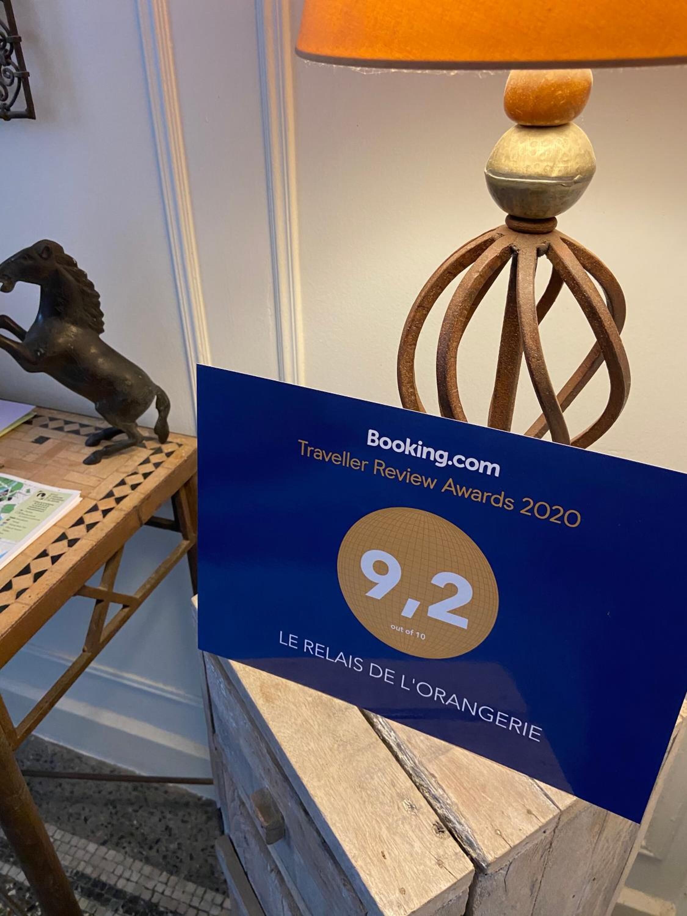 A blue award plaque for Booking.com Traveller Review Awards 2020 with a score of 9.2 out of 10.