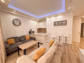 Superior Apartment, Balcony | Living area | Flat-screen TV