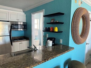 Fridge, microwave, oven, coffee/tea maker - Club Bamboo South unit 225, Anna Maria Island - Gulf Front Studio, ocean view, maximum occupancy of 4 people. (Bradenton Beach)