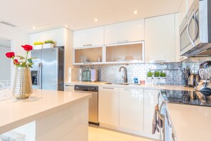 Fridge, microwave, oven, stovetop - Cozy designer condo across from the beach. WiFi, parking, tennis and more! (Sunny Isles Beach.)