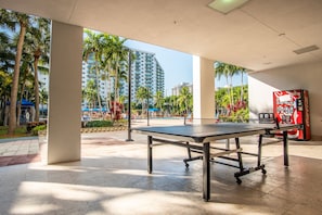 Relax and play in our spacious indoor recreation area, featuring a ping pong table and amenities like a vending machine.