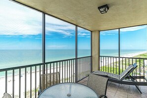 A balcony with a view of the ocean and beach. - Reflections 804 - GULF FRONT Condo! (Indian Rocks Beach)