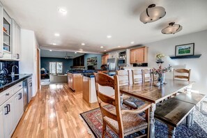 Enjoy meals in this well-equipped kitchen with a large dining table and ample counter space.