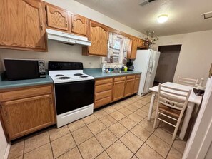 Coffee/tea maker, fridge, microwave, oven